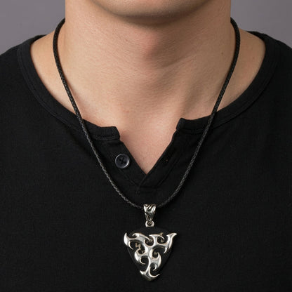 A piece of rock and roll jewelry, this silver pendant is a functional plectrum holder for guitarists.