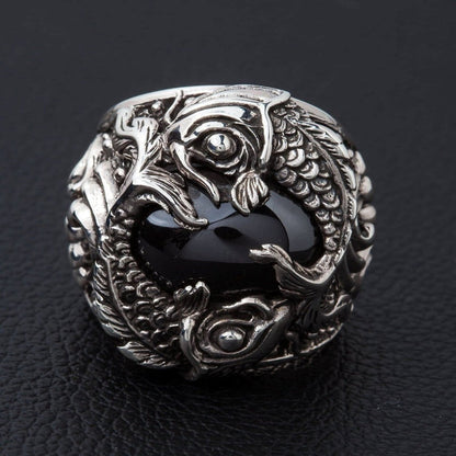 Sterling silver koi fish ring with black onyx cabochon front view showing twin fish design