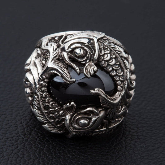 Sterling silver koi fish ring with black onyx cabochon front view showing twin fish design