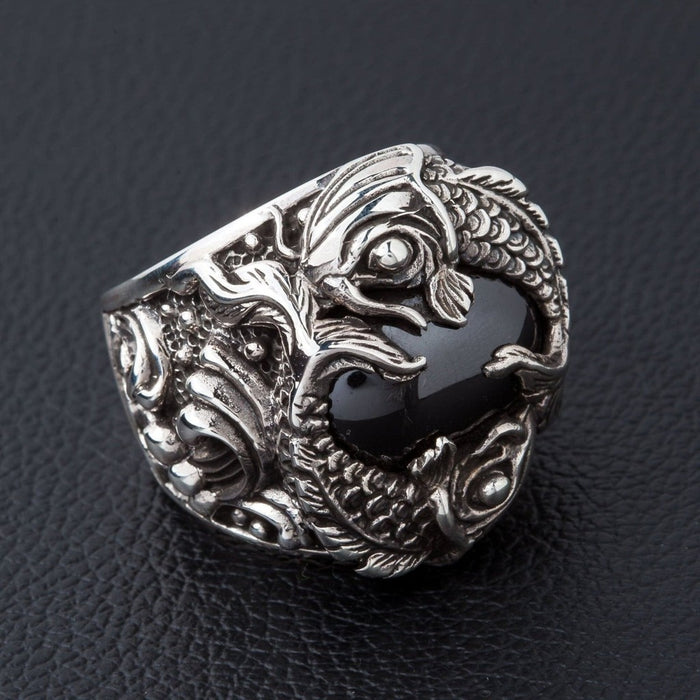 Detailed side angle of 925 sterling silver koi fish ring showing scale carving and onyx stone