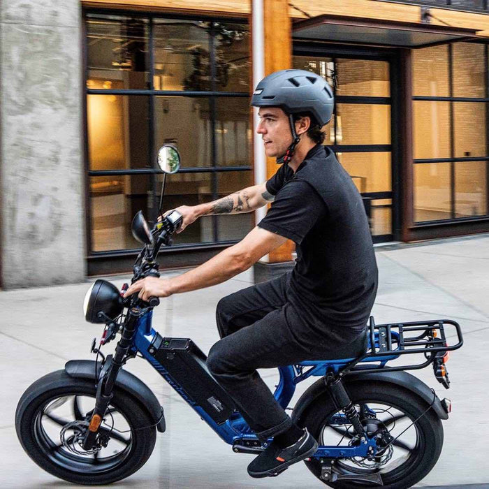 man on class 3 bike with ebike helmet about to tip over