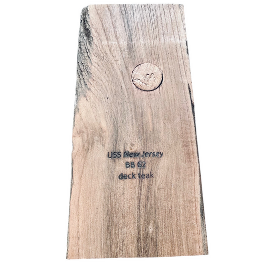 Wooden deck teak sample with USS New Jersey BB 62 text on a white background