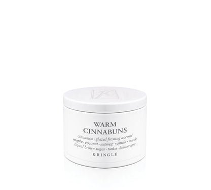 Kringle Creamery 'Warm Cinnabuns' candle tin on a white background