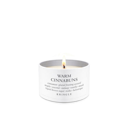 Kringle Candle tin with 'Warm Cinnabuns' description on a white background