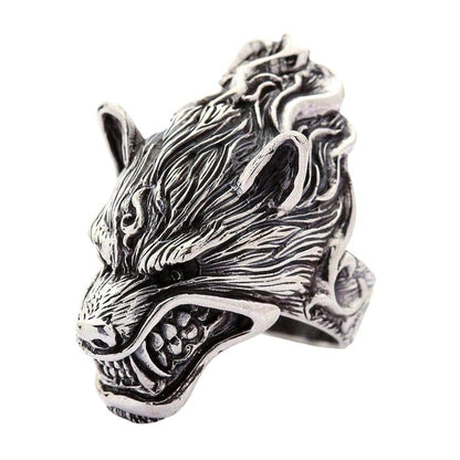 A close-up macro shot of the bared teeth and nose on the gothic-style werewolf jewelry piece.